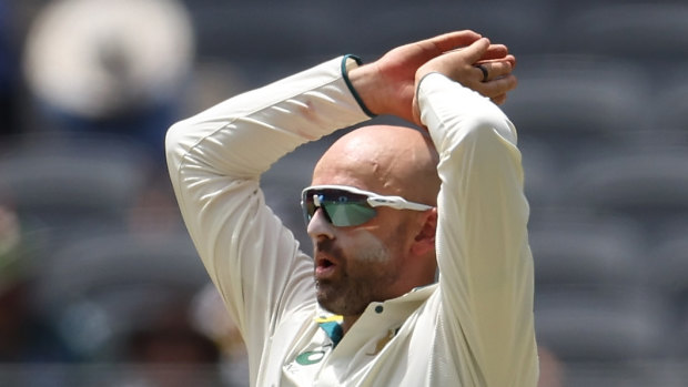 PERTH, AUSTRALIA - DECEMBER 16: Nathan Lyon of Australia  reacts after a delivery during day three of the Men’s First Test match between Australia and Pakistan at Optus Stadium