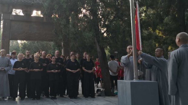 Foreign "disciples" attend the flag-raising ceremony.