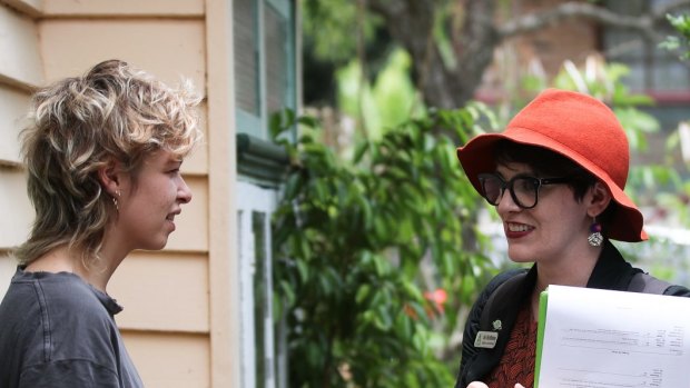 Greens candidate for South Brisbane, Amy MacMahon (right), doorknocking in the electorate of South Brisbane.