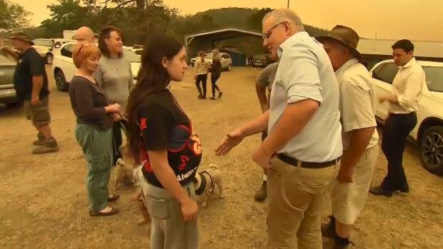 Zoey McDermott refuses to shake the hand of the Prime Minister during his visit to Cobargo.