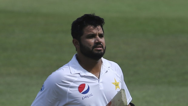 Boundary rider: A bemused Azhar Ali leaves the field after being run out.