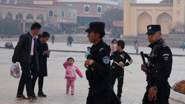 Security personnel on patrol in Xinjiang.