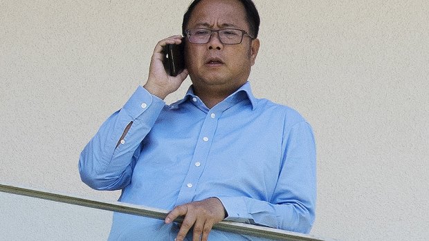 Deported Chinese political donor Huang Xiangmo on the balcony of his former Mosman home.