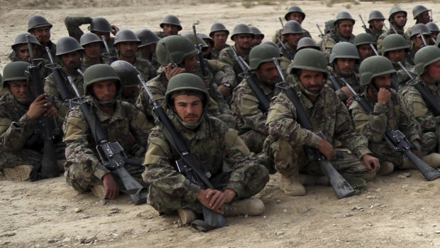Afghan National Army soldiers carry out an exercise during a live firing at the Afghan Military Academy in Kabul, Afghanistan. Afghan officials say about 100 soldiers fled their posts and tried to cross into neighbouring Turkmenistan during a week-long battle with the Taliban.