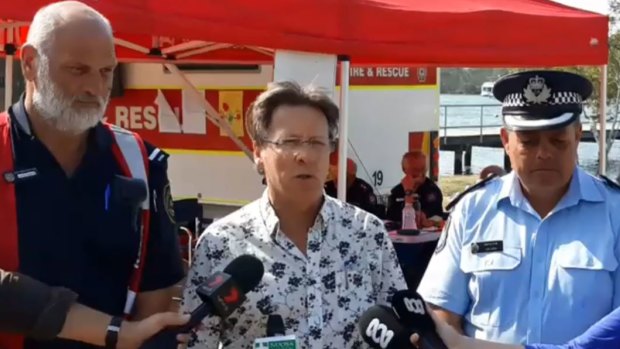 Mayor Tony Wellington, Inspector Jon Lewis from Queensland Police Service and Rural Fire Service Incident Controller Mark Roderick update the media in Noosa.