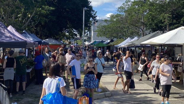 Shoppers at Jan Powers Farmers Market at the Brisbane Powerhouse on Saturday ignore the social-distancing requirements.