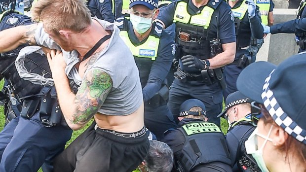 Protesters fighting with police when they were being arrested.