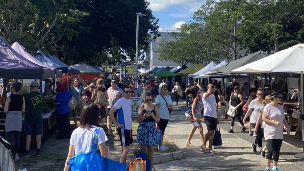 Shoppers at Jan Powers Farmers Market at the Brisbane Powerhouse ignore the social-distancing requirements.