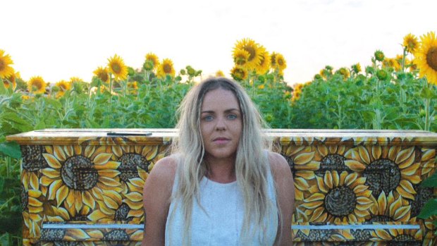 Holly Ogden has painted around 250 sunflowers all over Perth in a bid to create positive energy.
