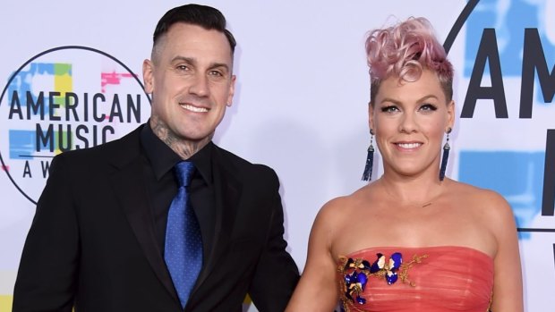 Carey Hart, left, with wife Pink.