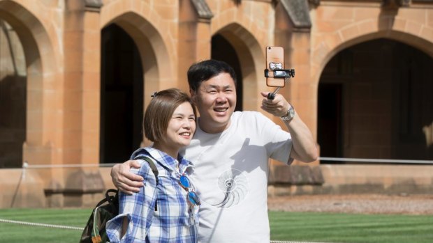 A group of Chinese people take a tour of the main quadrangle at Sydney University. Australia will become more Asian over time, says Malaysia's Prime Minister.