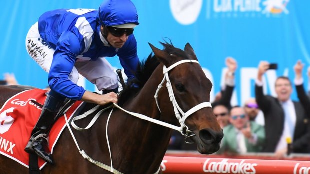 Crowning glory: Hugh Bowman steers Winx to a fourth Cox Plate victory in October.
