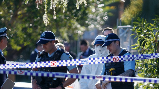 Police at the scene of a fatal stabbing in Russell Lea on Thursday.