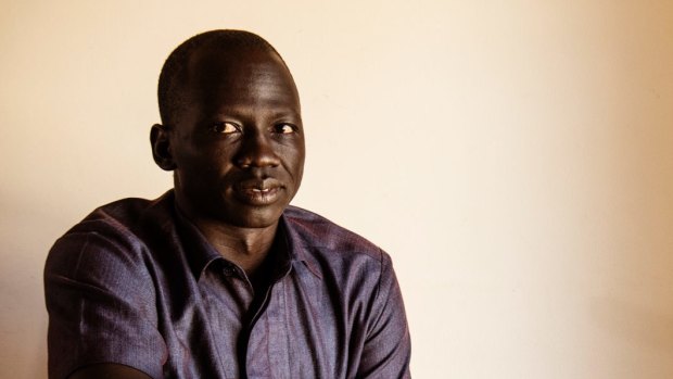 Majok Tulba, author at his Cranebrook home. He came to Australia as a refugee from South Sudan and has written about his own experience about fleeing rebel soldiers and surviving in a refugee camp.