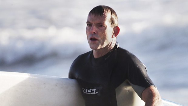 Tony Abbott, surfing in 2014.
