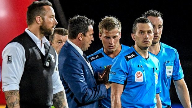 Who's in charge?: Mariners coach Paul Okon speaks with referee Alex King at the end of the controversial clash.