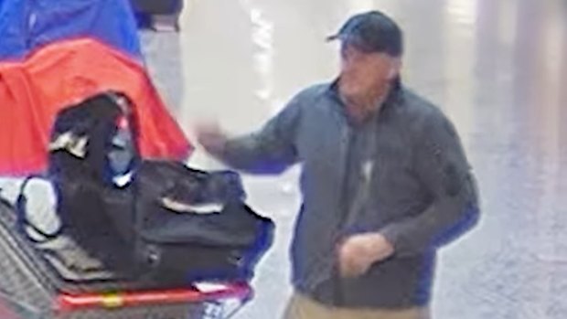 CCTV footage shows an unknown man collecting shoes at Kenmore Village Shopping Centre.