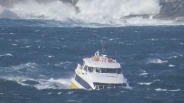 The Manly fast ferry crosses the Sydney Heads  through huge waves 