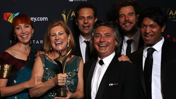 Angie Fielder (left) with the Lion filmmakers and Brierley family after winning best film at the AACTA Awards. 