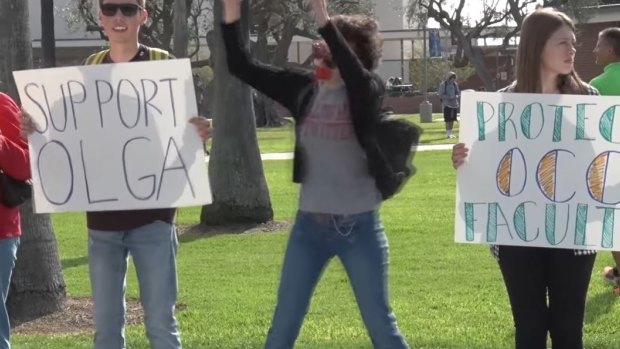 Students from Orange Coast College in Costa Mesa California hold a rally in support of human sexuality teacher Olga Cox earlier in December.