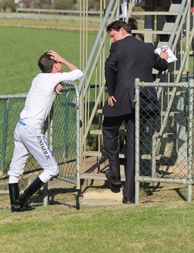 Jockey Danny Nikolic speaks with Terry Bailey at Seymour Races in September 2012.