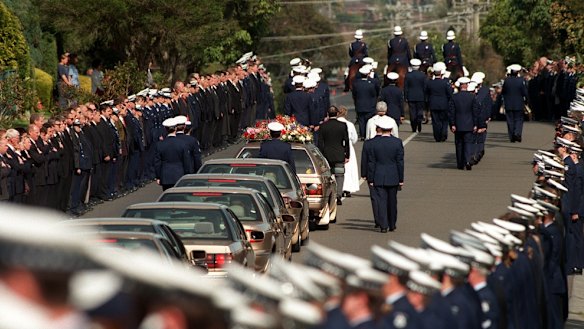 A guard of honour for Rodney Miller as his funeral procession passes the Victorian Police Academy in Glen Waverly on August 20, 1998. 