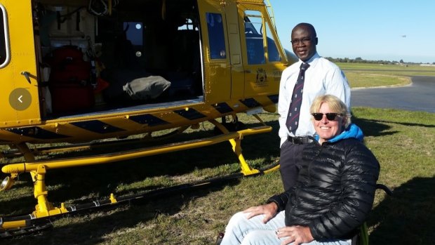 Doctor Edward Yeboah with Simon Treloar five months after his rescue. 