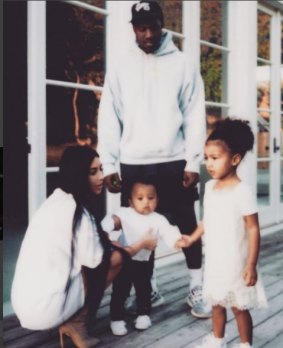 Kardashian West with husband Kanye West and their children, North and Saint.