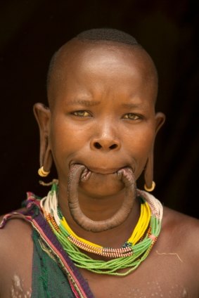 Ataye, a Surma woman in Ethiopia, is the world record holder for the biggest lip plate. CREDIT: Art Wolfe