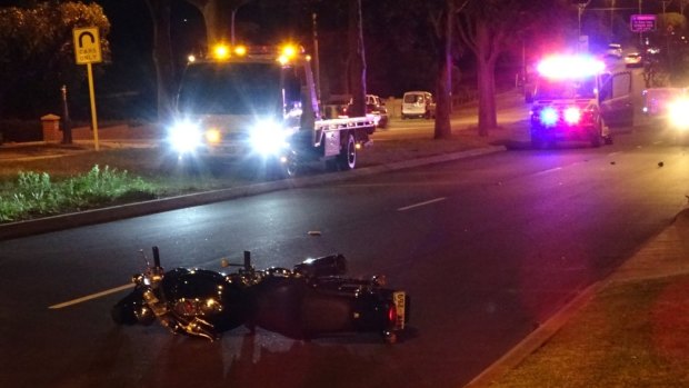 A woman has died after a crash with a black Kawasaki motorbike.