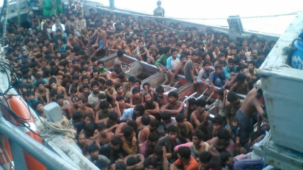 A boat packed with 727 migrants was intercepted off Myanmar's south coast on Friday.