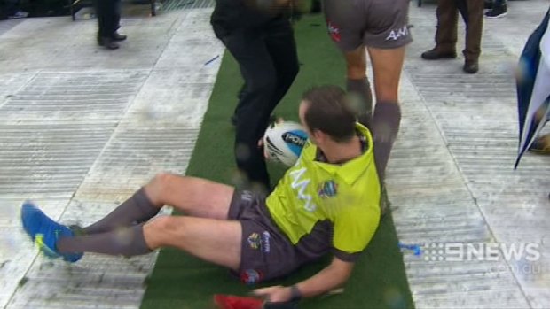 Club pays price for poor crowd behaviour: Linesman Nick Beashel hits the deck attempting to avoid a flying bottle.