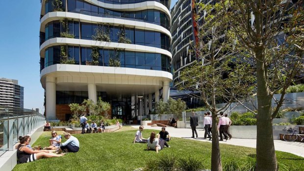 Workers relax outside Medibank's building at 720 Bourke Street.