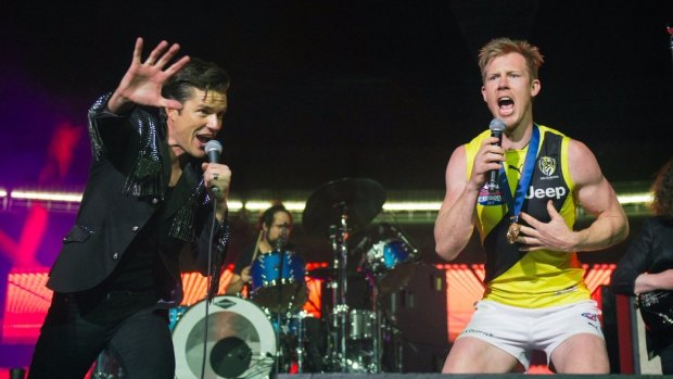 Jack Riewoldt and Brandon Flowers on stage after the grand final.