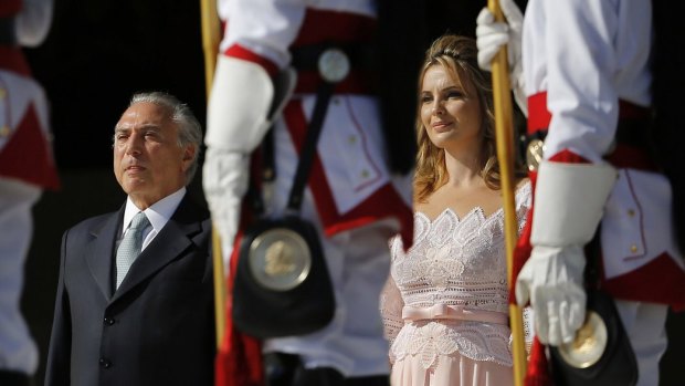 Then Vice-President Michel Temer and his wife Marcela Temer, stand for the national anthem on the inauguration of Rousseff's second term in 2015.