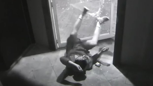 The man had almost executed his acrobatic performance when the door opened.