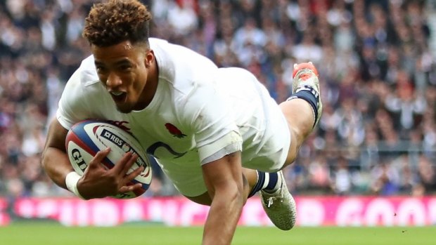 Anthony Watson of England scores his side's third try against Scotland.