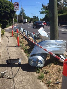 Safety barrier taken out by trucks travelling on Rosanna Road.