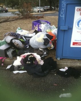Rubbish dumped beside charity bins in Kambah, as photographed by a resident.
