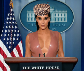 Kim's Jackie O moment with a pill box hat at a press conference.