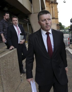 Out: Mike Gallacher leaves NSW Parliament House on Friday.