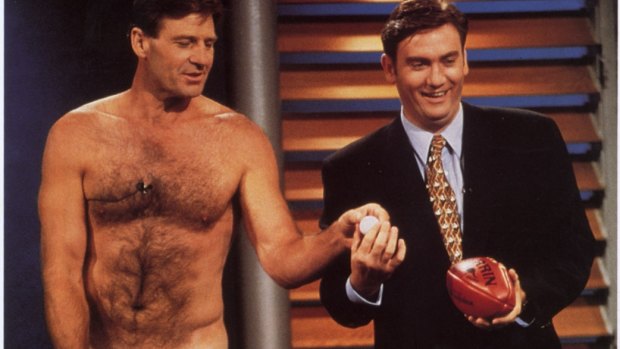 Back to the ''good old days'': Sam Newman wearing nothing but a strategically held football with Eddie McGuire on a 1997 episode of The Footy Show.