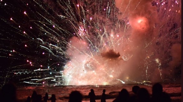 Crowds have been evacuated from Terrigal Beach, after a barge carrying fireworks caught alight during their 9pm show.