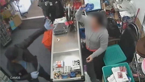 A woman scares off an armed attacker with a pricing gun.