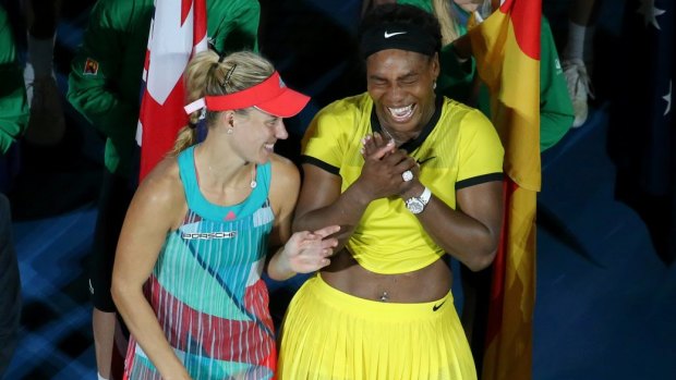 Bright side: Angelique Kerber has a laugh with Serena Williams during the trophy presentation ceremony.