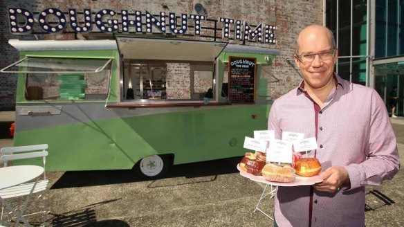 Doughnut Time owner Damian Griffiths with "Barbara", the restored vintage 1965 Carapark Astronaut.