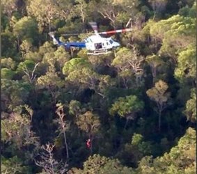 Geoff Keys being winched aboard a rescue helicopter after two days lost in Jardine National Park.