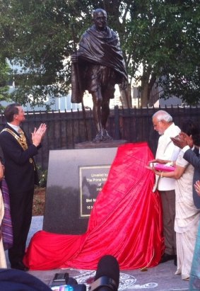 Indian Prime Minister Narendra Modi and Brisbane Lord Mayor Graham Quirk unveil a statue for Mahatma Gandhi in Brisbane.