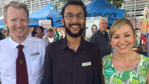 Jonathan Sri (centre, with lord mayoral candidate Ben Pennings and Senator Larissa Waters) is on track to win The Gabba.