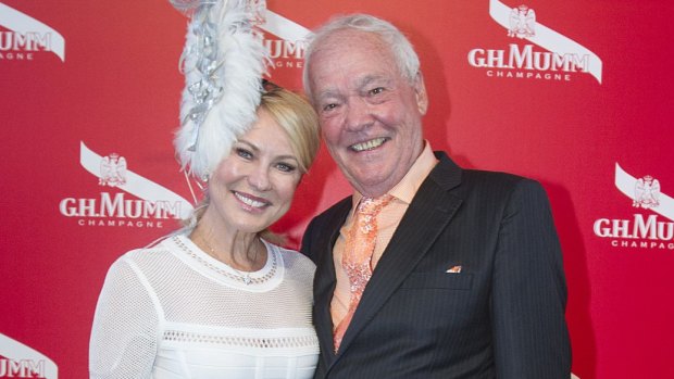 Kerri-Anne Kennerley and John Kennerley pose on Derby Day at Flemington Racecourse in 2015.